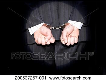 Stock Photography - spotlight on businessman 
with hands cuffed. 
fotosearch - search 
stock photos, 
pictures, images, 
and photo clipart