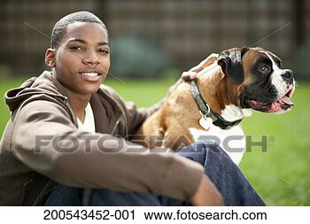 Stock Photography - teenage boy (14-16) 
and dog outdoors, 
boy smiling. fotosearch 
- search stock 
photos, pictures, 
images, and photo 
clipart