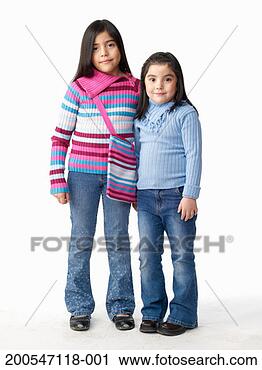 Stock Photography - two sisters (5-9) 
with black hair, 
on white background, 
portrait. fotosearch 
- search stock 
photos, pictures, 
images, and photo 
clipart