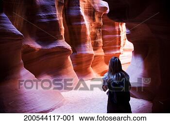 Stock Photography - usa, arizona, 
antelope canyon, 
woman inside canyon, 
rear view. fotosearch 
- search stock 
photos, pictures, 
images, and photo 
clipart