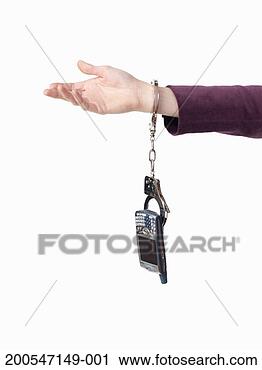 Stock Photography - woman with handcuffs 
on wrist, on white 
background. fotosearch 
- search stock 
photos, pictures, 
images, and photo 
clipart