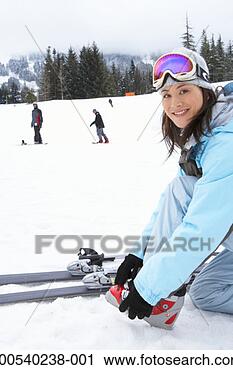 Stock Photography - woman with skis 
at base of mountain, 
portrait, side 
view. fotosearch 
- search stock 
photos, pictures, 
images, and photo 
clipart