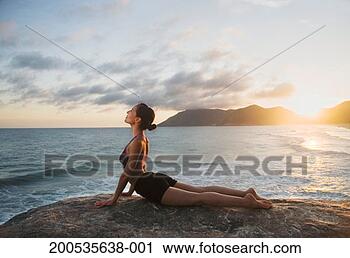 Stock Photography - woman doing upward 
facing dog. fotosearch 
- search stock 
photos, pictures, 
images, and photo 
clipart