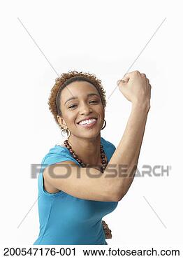 Stock Photography - young woman tensing 
arm muscles, on 
white background, 
portrait. fotosearch 
- search stock 
photos, pictures, 
images, and photo 
clipart