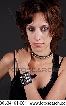 Stock Photography - young woman wearing 
studded necklace 
and bracelet, 
portrait. fotosearch 
- search stock 
photos, pictures, 
images, and photo 
clipart