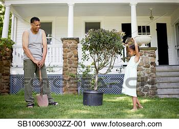 Stock Photography - father and daughter 
(8-9 years) preparing 
to plant tree 
in front of. fotosearch 
- search stock 
photos, pictures, 
images, and photo 
clipart