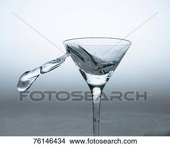 Stock Photo - martini glass 
with water swirling 
out. fotosearch 
- search stock 
photos, pictures, 
images, and photo 
clipart