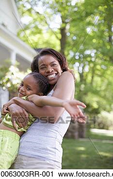 Stock Photography - mother embracing 
daughter (8-9 
years) in domestic 
garden, portrait. 
fotosearch - search 
stock photos, 
pictures, images, 
and photo clipart