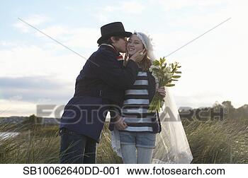 Stock Photography - portrait of teenage 
girl (16-17) and 
teenage boy (14-15) 
at seashore. fotosearch 
- search stock 
photos, pictures, 
images, and photo 
clipart