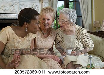 Stock Photography - two senior women 
and mature woman 
talking on sofa. 
fotosearch - search 
stock photos, 
pictures, images, 
and photo clipart