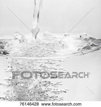 Stock Photo - water being poured, 
close-up, surface 
view. fotosearch 
- search stock 
photos, pictures, 
images, and photo 
clipart