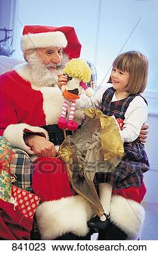 Stock Photo - girl unwrapping 
presents with 
father christmas. 
fotosearch - search 
stock photos, 
pictures, images, 
and photo clipart