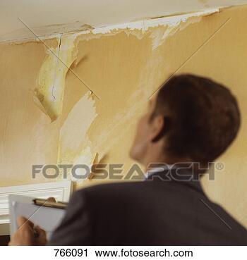 Stock Photography - surveyor looking 
upwards at a cracked 
wall. fotosearch 
- search stock 
photos, pictures, 
images, and photo 
clipart