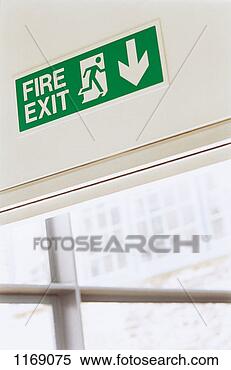 Stock Image - fire exit sign 
on top of a door 
in an office. 
fotosearch - search 
stock photos, 
pictures, images, 
and photo clipart