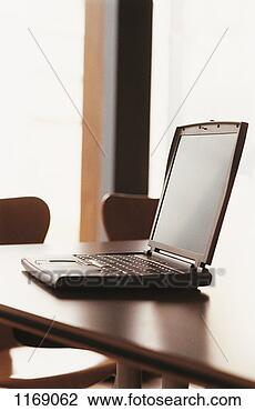 Stock Photo - laptop on a conference 
room table. fotosearch 
- search stock 
photos, pictures, 
images, and photo 
clipart