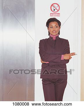 Stock Photo - young businesswoman 
smoking a cigarette 
below a no smoking 
sign. fotosearch 
- search stock 
photos, pictures, 
images, and photo 
clipart