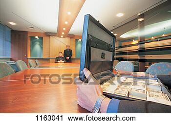 Stock Photography - businessman with 
an open briefcase 
full of money 
and businessmen. 
fotosearch - search 
stock photos, 
pictures, images, 
and photo clipart
