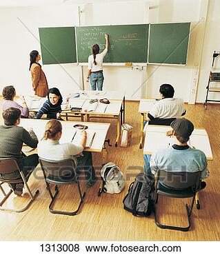 Stock Photo - lecturer with 
students sitting 
behind desks in 
a seminar,  watching 
a. fotosearch 
- search stock 
photos, pictures, 
images, and photo 
clipart