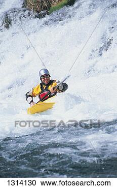 Stock Photography - man rowing a kayak 
in rapids. fotosearch 
- search stock 
photos, pictures, 
images, and photo 
clipart