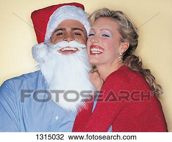 Stock Photo - portrait of a 
woman with a man 
wearing a father 
christmas fancy 
dress. fotosearch 
- search stock 
photos, pictures, 
images, and photo 
clipart