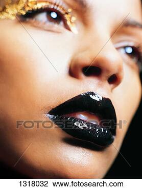 Stock Photo - headshot of a 
young woman wearing 
shiny lipstick 
and eye shadow. 
fotosearch - search 
stock photos, 
pictures, images, 
and photo clipart