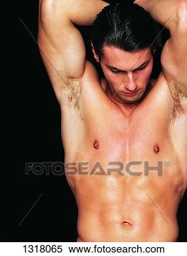Stock Image - muscular male 
nude with his 
arms upstretched 
and looking down. 
fotosearch - search 
stock photos, 
pictures, images, 
and photo clipart