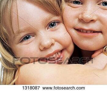 Picture - portrait of two 
sisters in an 
embrace. fotosearch 
- search stock 
photos, pictures, 
images, and photo 
clipart