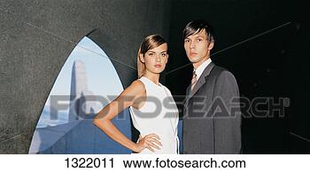Stock Photography - portrait of a 
young business 
couple standing 
beside concrete 
arch. fotosearch 
- search stock 
photos, pictures, 
images, and photo 
clipart