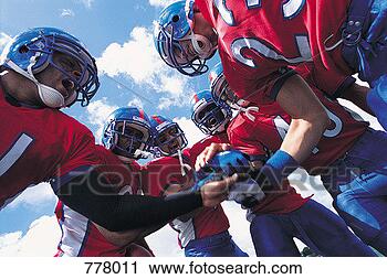 Stock Photography - american football 
players bonding 
before the game. 
fotosearch - search 
stock photos, 
pictures, images, 
and photo clipart
