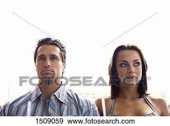 Stock Photograph - front view of 
a daydreaming 
couple side by 
side. fotosearch 
- search stock 
photos, pictures, 
images, and photo 
clipart
