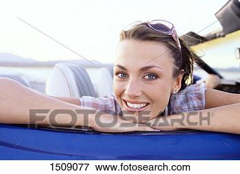 Picture - woman leaning 
her head on her 
hands on the passenger 
door of a. fotosearch 
- search stock 
photos, pictures, 
images, and photo 
clipart