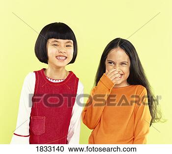 Stock Photography - portrait of two 
giggling girls, 
one with her hand 
over her mouth. 
fotosearch - search 
stock photos, 
pictures, images, 
and photo clipart
