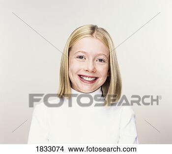 Stock Photo - studio portrait 
of a young girl 
in a white polo-neck 
jumper smiling. 
fotosearch - search 
stock photos, 
pictures, images, 
and photo clipart