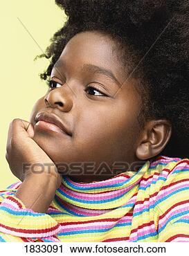 Stock Photography - studio shot of 
a young girl in 
a striped jumper 
leaning her chin 
on. fotosearch 
- search stock 
photos, pictures, 
images, and photo 
clipart