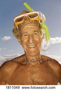 Stock Photograph - portrait of a 
senior man wearing 
a scuba mask and 
snorkel. fotosearch 
- search stock 
photos, pictures, 
images, and photo 
clipart