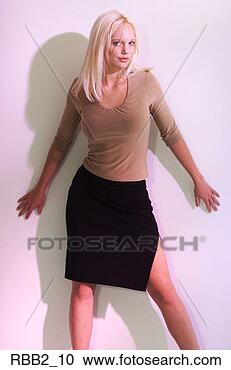 Stock Photography - an attractive 
caucasian blonde 
woman in a black 
skirt and tan 
blouse. fotosearch 
- search stock 
photos, pictures, 
images, and photo 
clipart