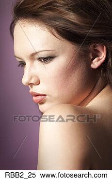 Stock Image - a young caucasian 
brunette stares 
off into the distance 
and shows her. 
fotosearch - search 
stock photos, 
pictures, images, 
and photo clipart