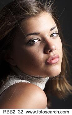 Stock Photo - a young pretty 
caucasian female 
looks seriously 
into the camera 
as. fotosearch 
- search stock 
photos, pictures, 
images, and photo 
clipart