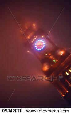 Stock Photo - clock on building 
in fog. fotosearch 
- search stock 
photos, pictures, 
images, and photo 
clipart