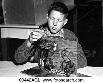 Stock Photo - boy working on 
science experiment. 
fotosearch - search 
stock photos, 
pictures, images, 
and photo clipart