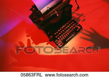 Stock Photo - shadow of hands 
hovering above 
old-fashioned 
typewriter copyrightjohn. 
fotosearch - search 
stock photos, 
pictures, images, 
and photo clipart