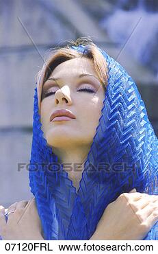 Stock Photo - woman wearing 
scarf on her head, 
eyes closed, looking 
up. fotosearch 
- search stock 
photos, pictures, 
images, and photo 
clipart