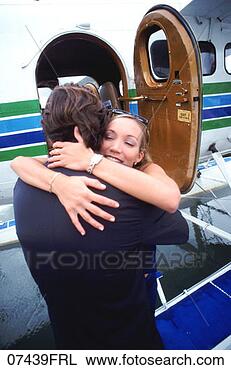 Stock Photo - couple embracing 
beside seaplane. 
fotosearch - search 
stock photos, 
pictures, images, 
and photo clipart
