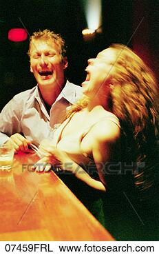 Stock Photo - couple laughing 
at bar. fotosearch 
- search stock 
photos, pictures, 
images, and photo 
clipart