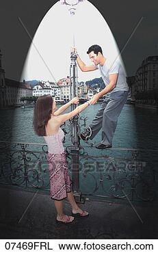 Stock Photo - couple playing 
around lamppost. 
fotosearch - search 
stock photos, 
pictures, images, 
and photo clipart