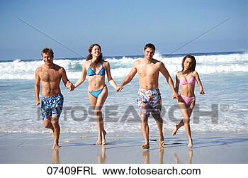 Stock Photo - people running 
hand-in-hand on 
the beach. fotosearch 
- search stock 
photos, pictures, 
images, and photo 
clipart