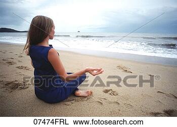 Stock Photo - woman meditating 
at the beach. 
fotosearch - search 
stock photos, 
pictures, images, 
and photo clipart