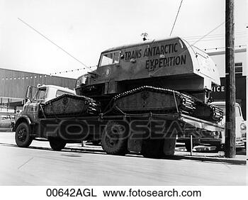 Stock Photo - flatbed truck 
transporting over-snow 
vehicle,  trans 
antarctic. fotosearch 
- search stock 
photos, pictures, 
images, and photo 
clipart