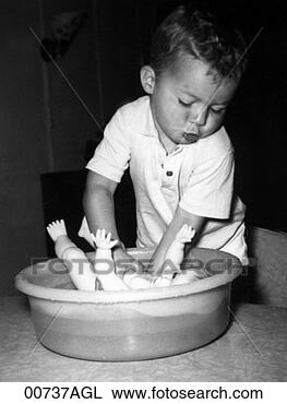 Stock Photo - boy bathing doll. 
fotosearch - search 
stock photos, 
pictures, images, 
and photo clipart