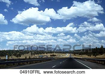 Stock Photo - highway headed 
into evergreen 
forest. fotosearch 
- search stock 
photos, pictures, 
images, and photo 
clipart